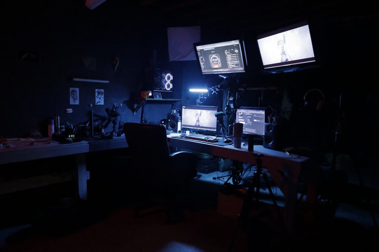 The TacticalTech3D design desk at night with four monitors, running design and slicing software.